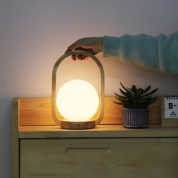 https://forlightsleepers.com/wp-content/uploads/2022/03/Orb-%E2%80%93-Portable-Wooden-LED-Lantern-2-1.webp